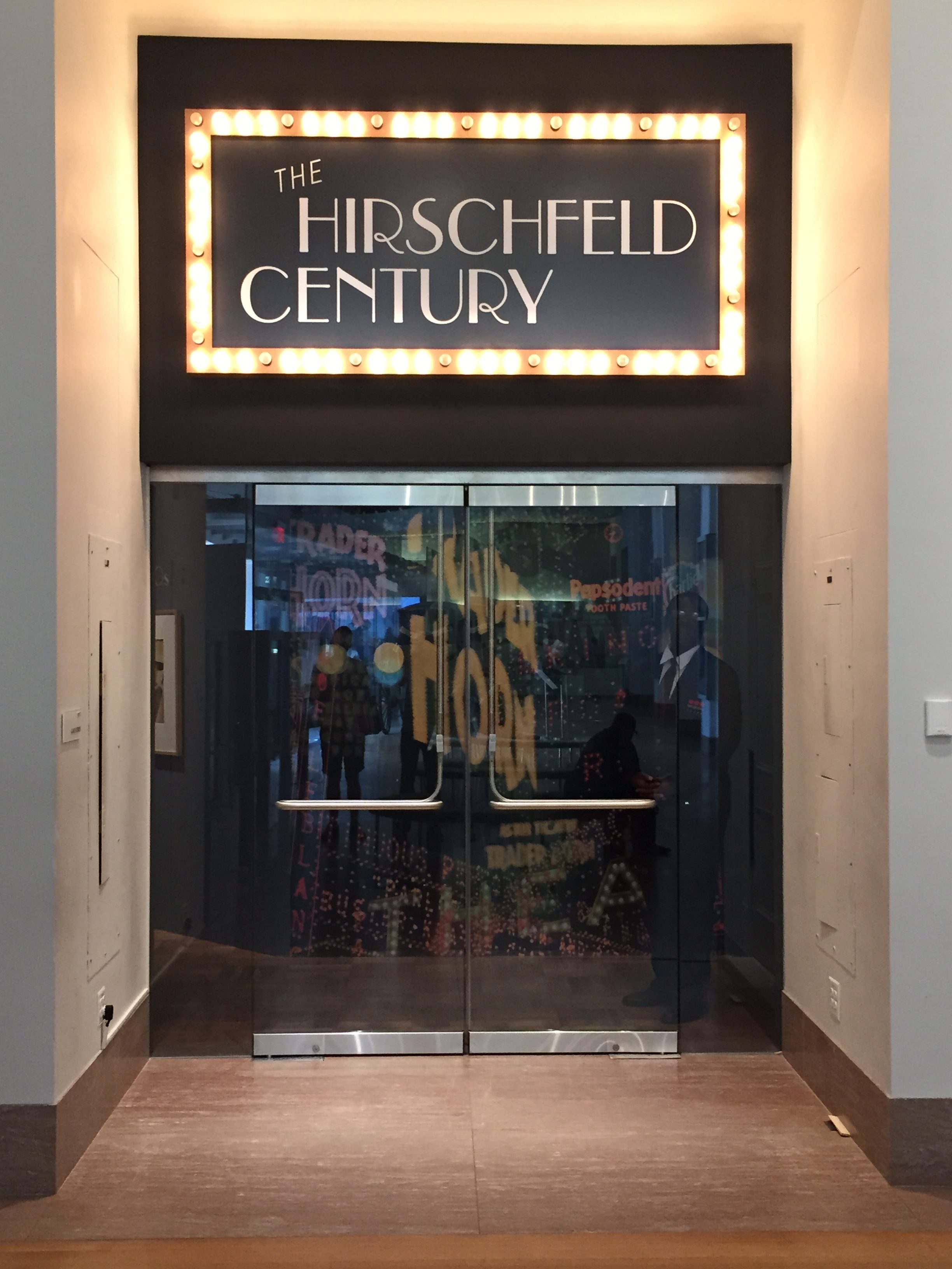 Photo of a door with the sign The Hirschfeld Century 