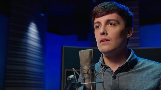 Evan from the Toronto Production of Dear Evan Hansen singing in a dark recording studio