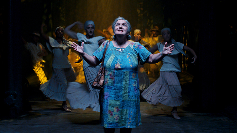 Olga Merediz (center) as Abuela Claudia in Warner Bros. Pictures’ <i>In the Heights</i> a Warner Bros. Pictures release. Photo courtesy of Warner Bros. Pictures.