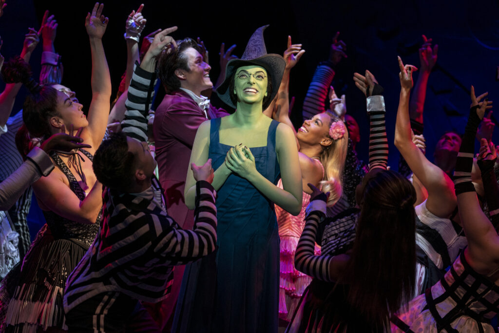 Talia Suskauer and the Cast of Wicked. Photo by Joan Marcus.