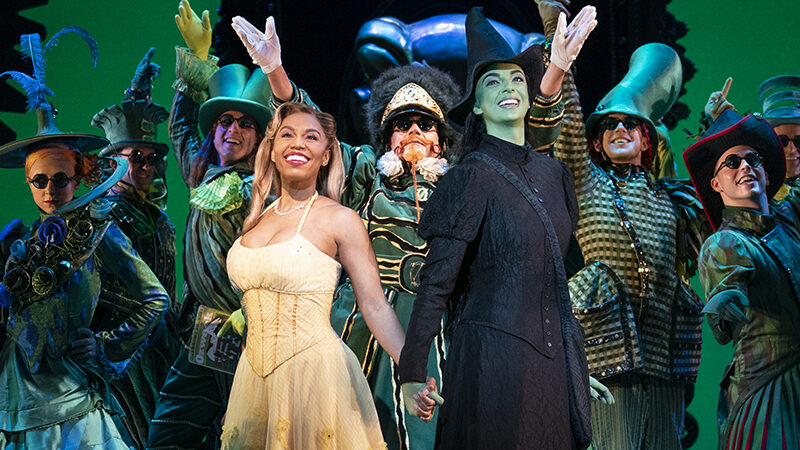 Brittney Johnson, Talia Suskauer, and the Cast of Wicked. Photo by Joan Marcus.