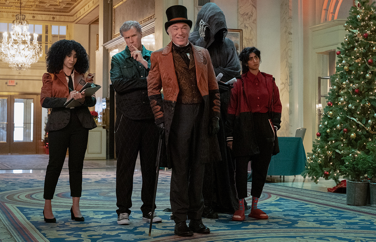 Loren Woods, Will Ferrell, Patrick Page, Sunita Mani, and a "Ghost PA" in <i>Spirited</i>, now streaming on Apple TV+. Photo courtsey of Apple.