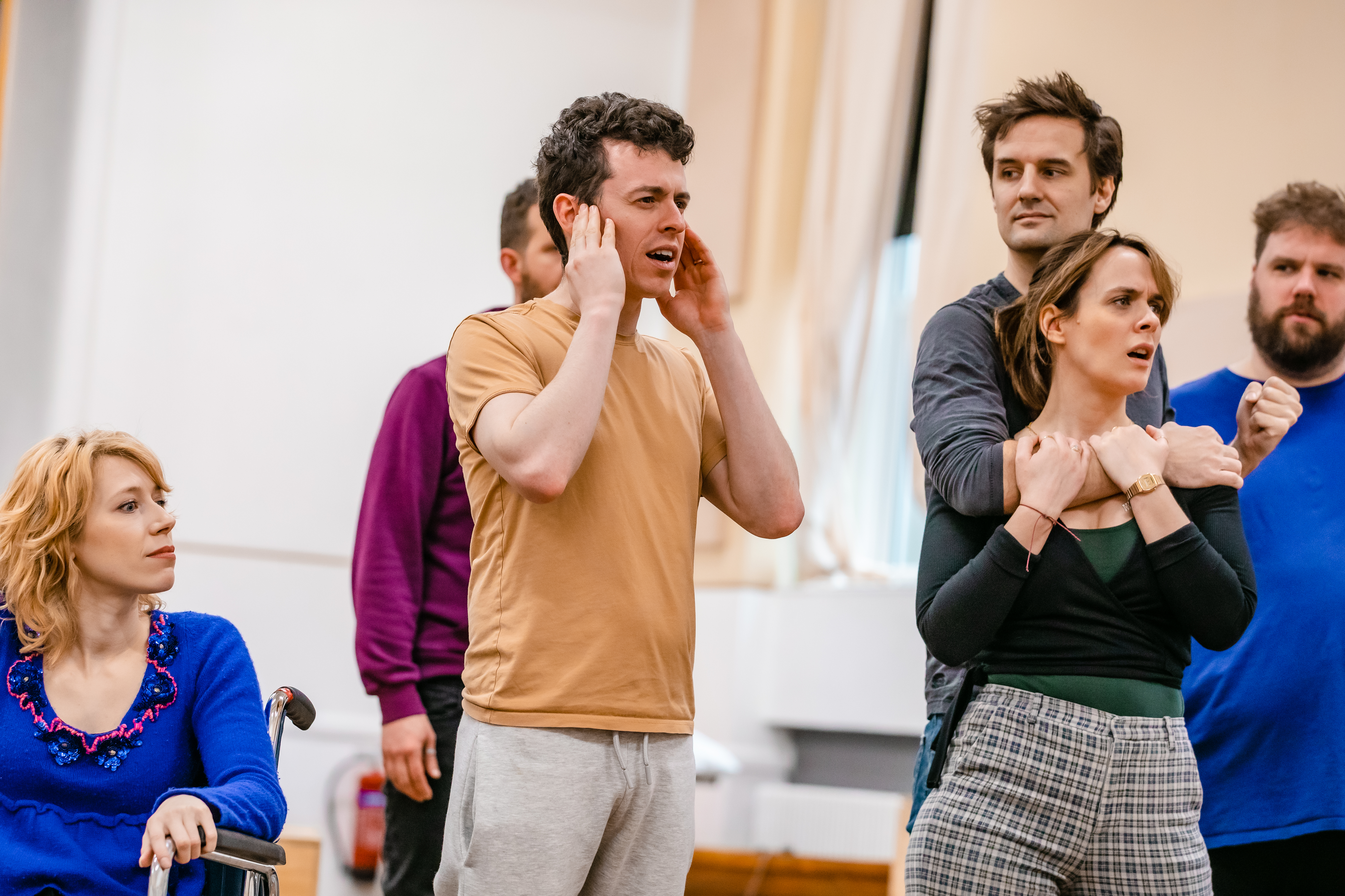 Ellie Morris, Jonathan Sayer, Henry Shields, Charlie Russell, and Henry Lewis in rehearsals for Peter Pan Goes Wrong. Photo by Danny Kaan.