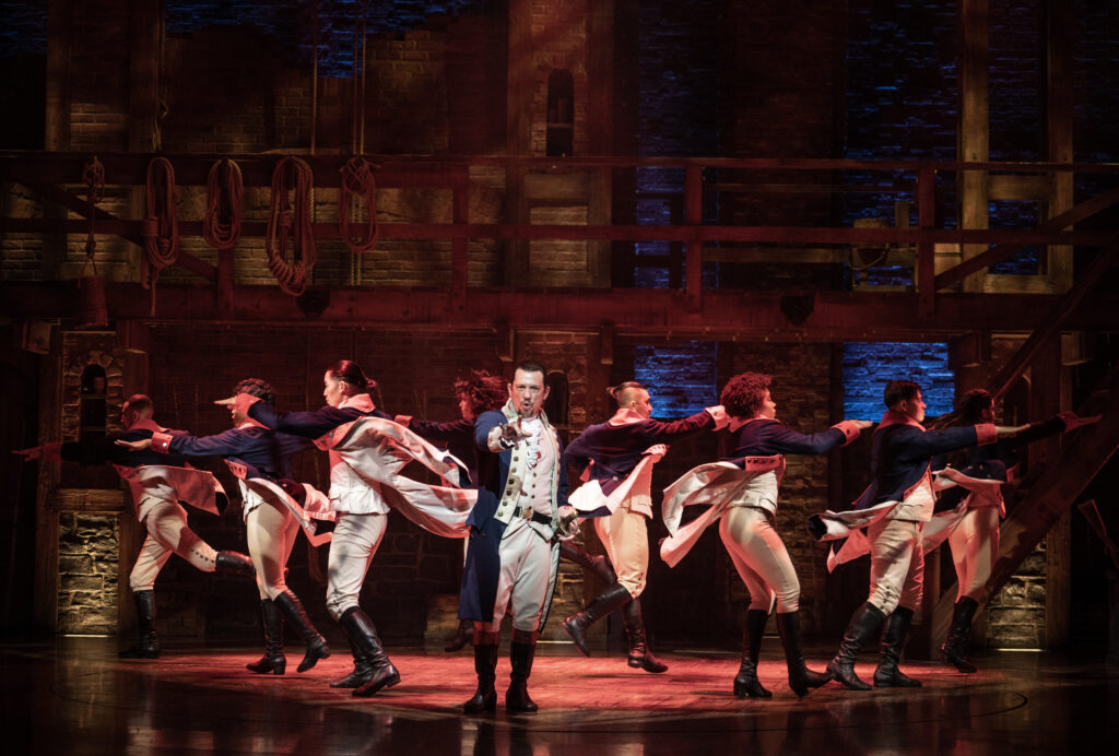 Miguel Cervantes and the cast of Hamilton. Photo by Joan Marcus.