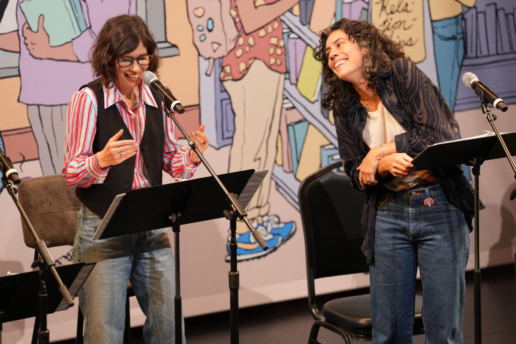Carrie Brownstein and Roberta Colindrez speak onstage at Audible Presents "Alison Bechdel's Dykes to Watch Out For - One Night Stand" at Minetta Lane Theatre. Photo by Ilya S. Savenok/Getty Images for Audible.