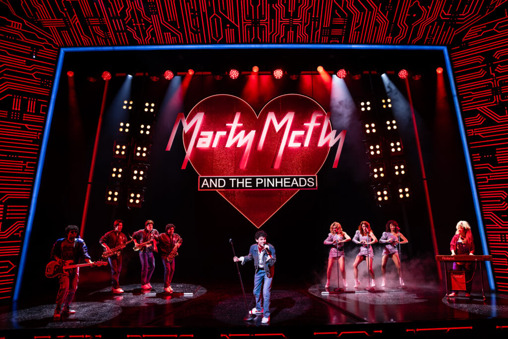 Casey Likes and the cast of Back to the Future: The Musical. Photo by Matthew Murphy and Evan Zimmerman.