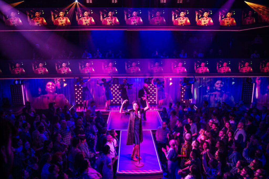 Arielle Jacobs and the cast of Here Lies Love. Photo by Billy Bustamante, Matthew Murphy, and Evan Zimmerman.
