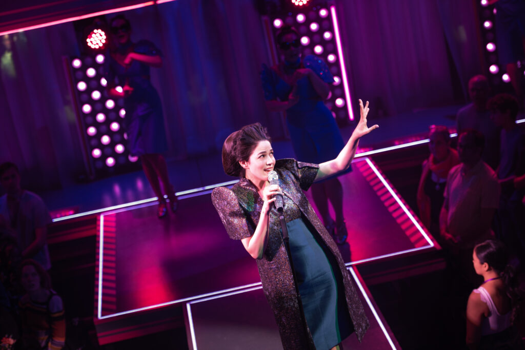 Arielle Jacobs in Here Lies Love. Photo by Billy Bustamante, Matthew Murphy, and Evan Zimmerman.