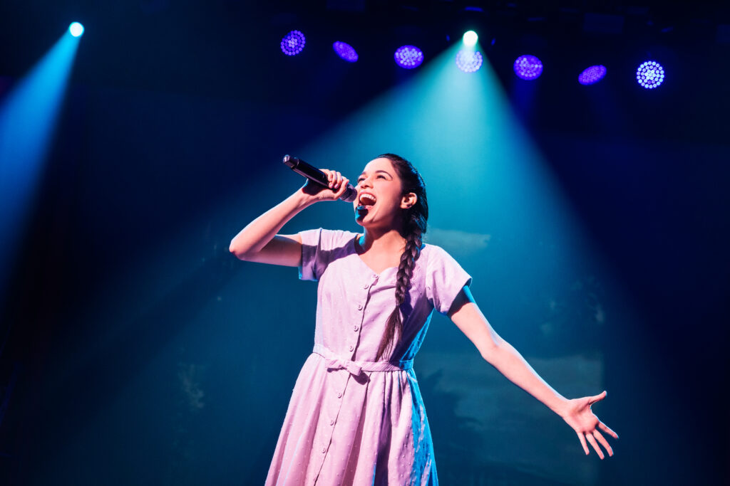 Arielle Jacobs in Here Lies Love. Photo by Billy Bustamante, Matthew Murphy, and Evan Zimmerman.