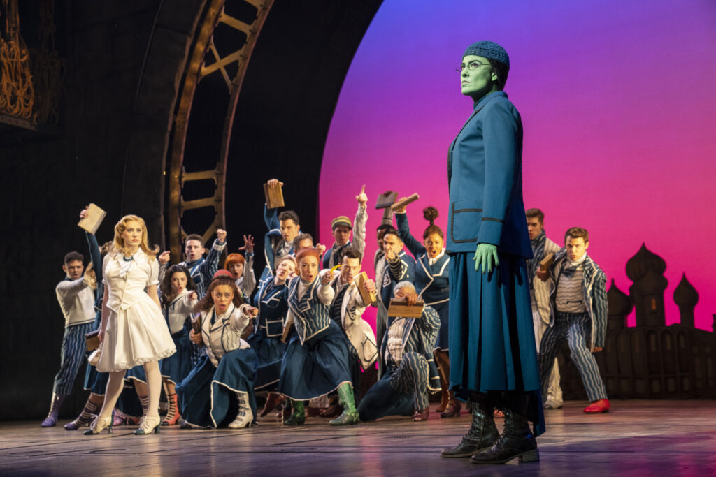 McKenzie Kurtz, Alyssa Fox, and the cast of Wicked. Photo by Joan Marcus.