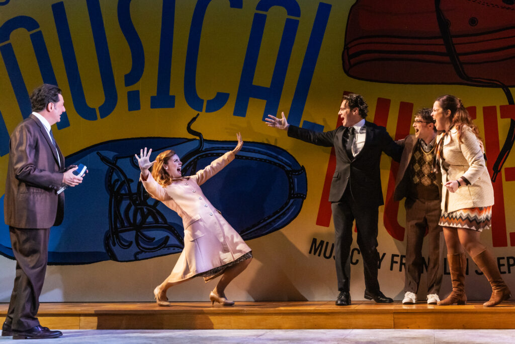 Reg Rogers, Katie Rose Clarke, Jonathan Groff, Daniel Radcliffe, and Lindsay Mendez in Merrily We Roll Along. Photo by Matthew Murphy.