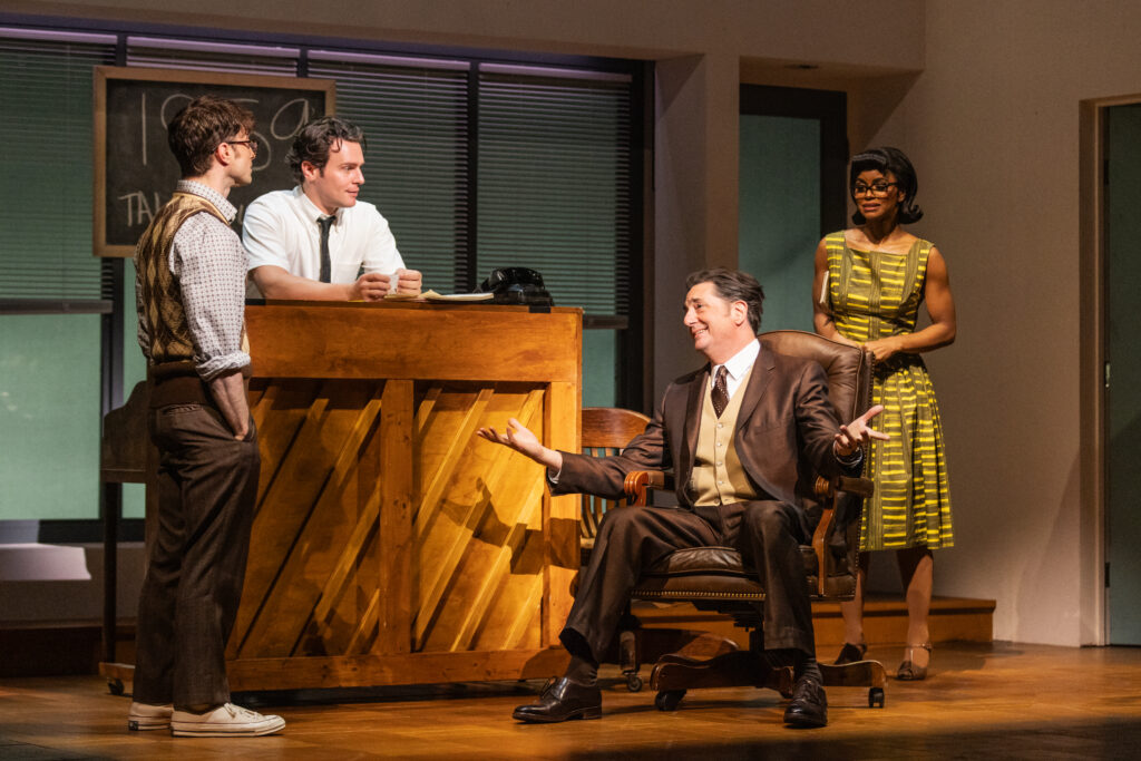 Daniel Radcliffe, Jonathan Groff, Reg Rogers, and Krystal Joy Brown in Merrily We Roll Along. Photo by Matthew Murphy.