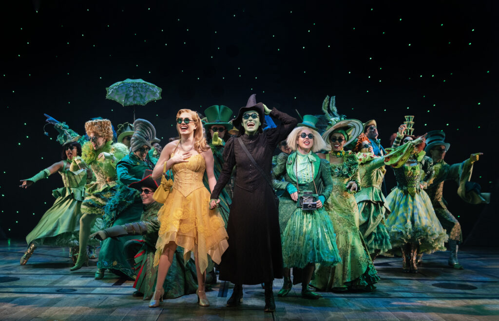 0183r_McKenzie Kurtz, Alyssa Fox, and the Company of WICKED. Photo by Joan Marcus.