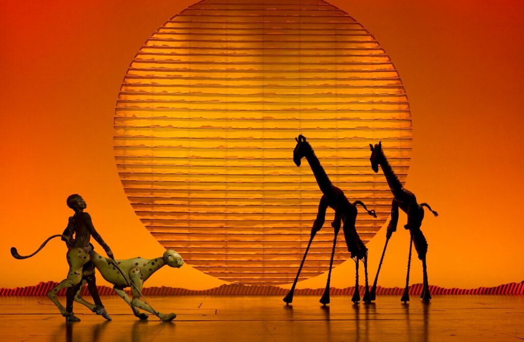 Circle of Life Cheetah and Giraffes in The Lion King. Photo by Joan Marcus.