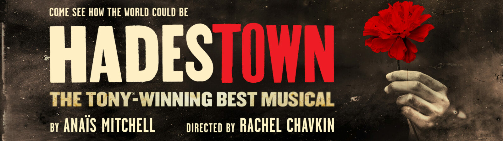 'Hadestown' title in beige and red all caps. Below text writes 'The Tony-Winning Best Musical' in beige all caps. Image to the right is a hand holding out a red flower