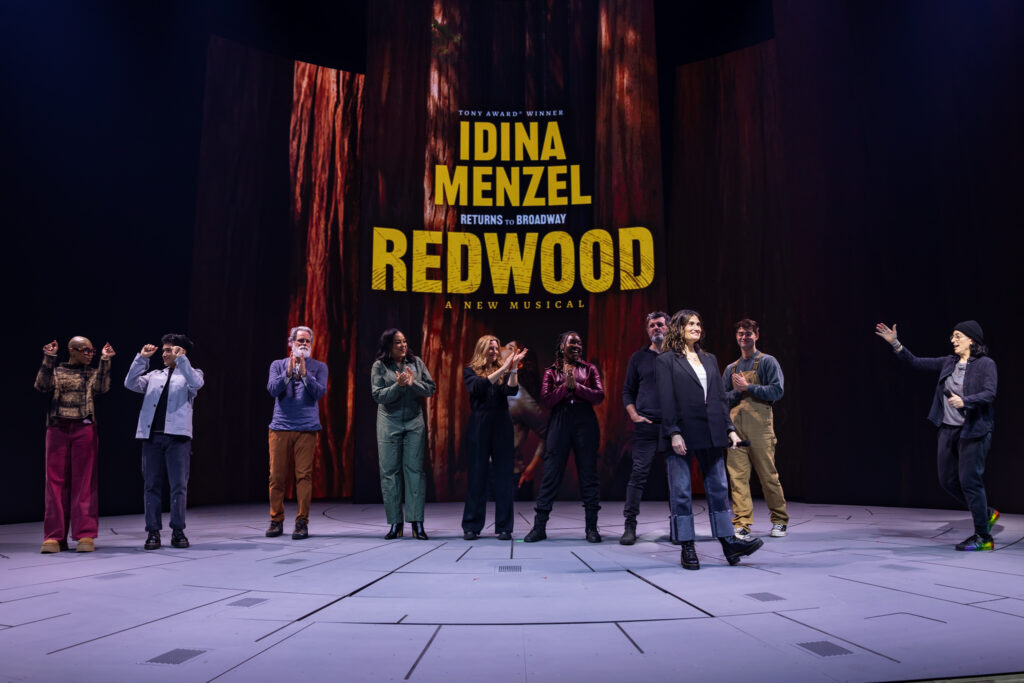 Khaila Wilcoxon, Zachary Noah Piser, Michael Park, De’Adre Aziza, Jessica Phillips, Veronica Otim, Bradley Dean, Idina Menzel, Daniel Brackett, and Tina Landau of Redwood. Photo by Rebecca J Michelson for Broadway Direct.