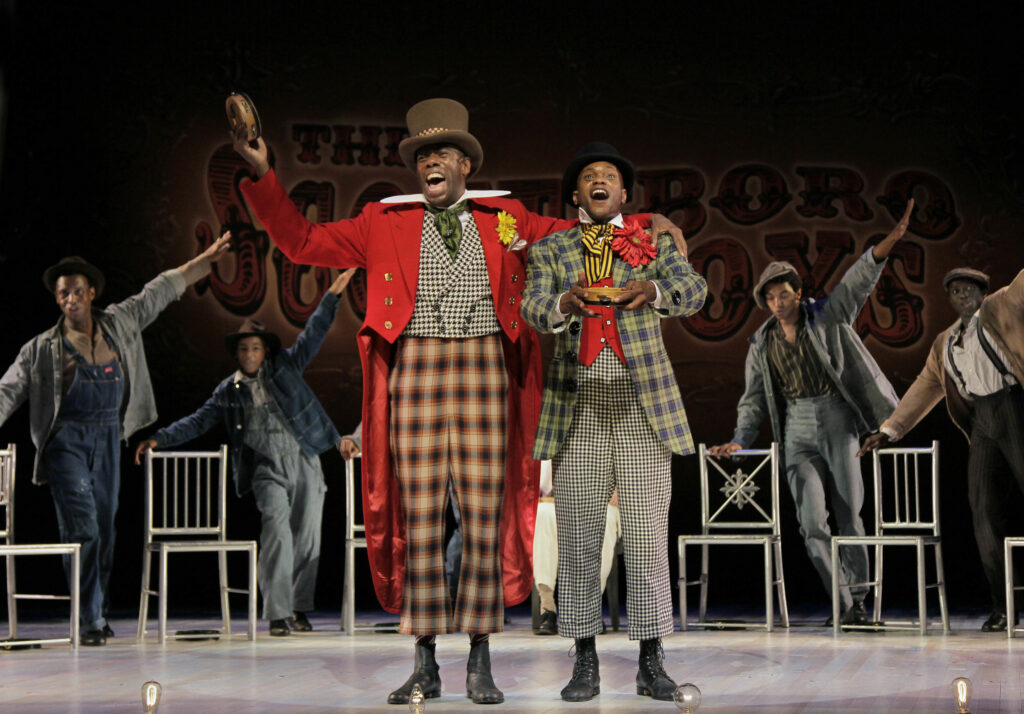 Colman Domingo and Forrest McClendon inThe Scottsboro Boys. Photo by Paul Kolnik.