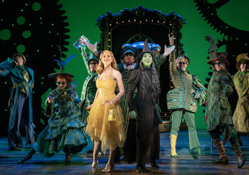 Allie Trimm, Lencia Kebede, and the cast of Wicked. Photo by Joan Marcus.