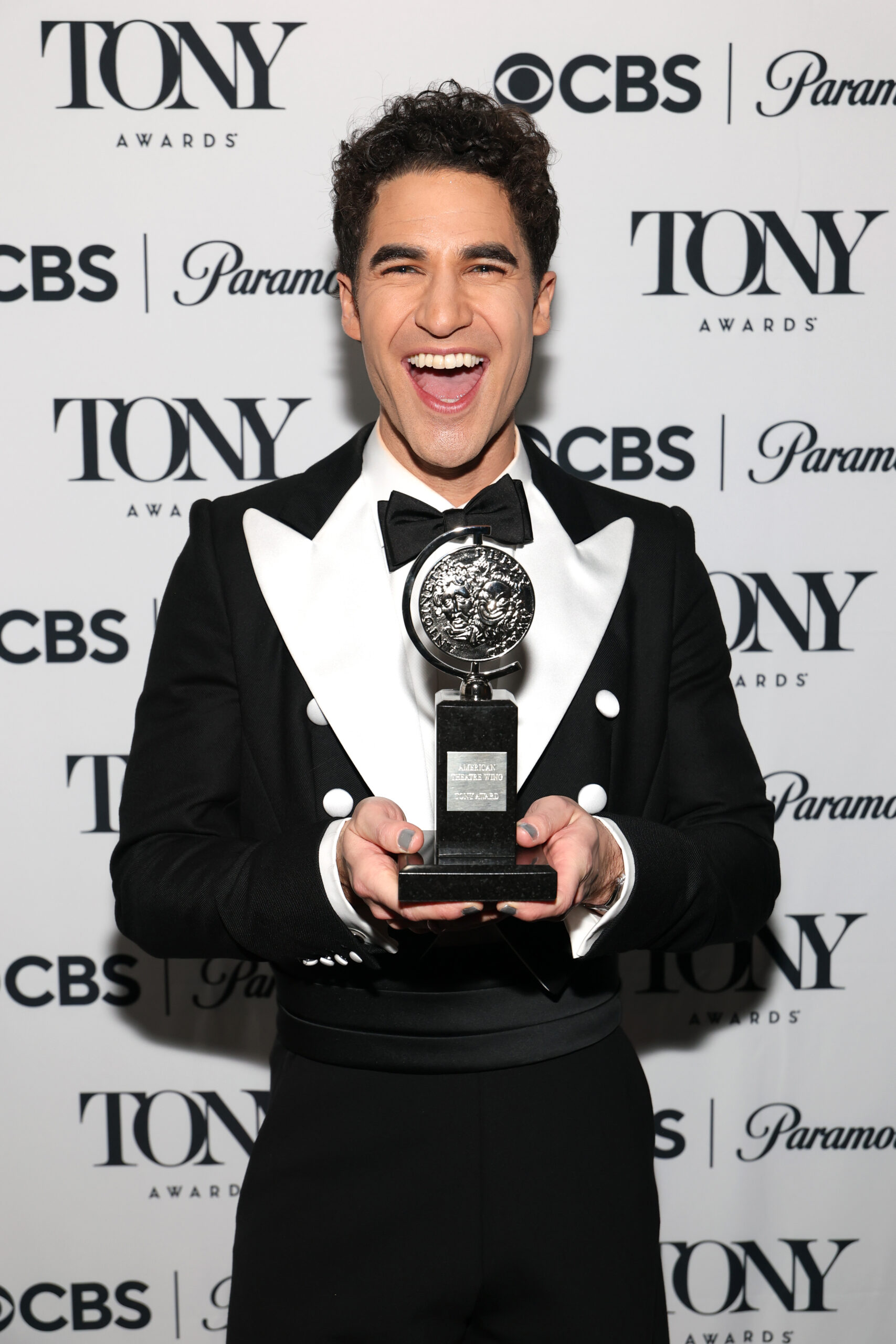 Darren Criss poses with the Best Performance by an Actor in a Leading Role in a Musical award for Maybe Happy Ending award during The 78th Annual Tony Awards at Radio City Music Hall. Photo by Jenny Anderson/Getty Images for Tony Awards Productions.
