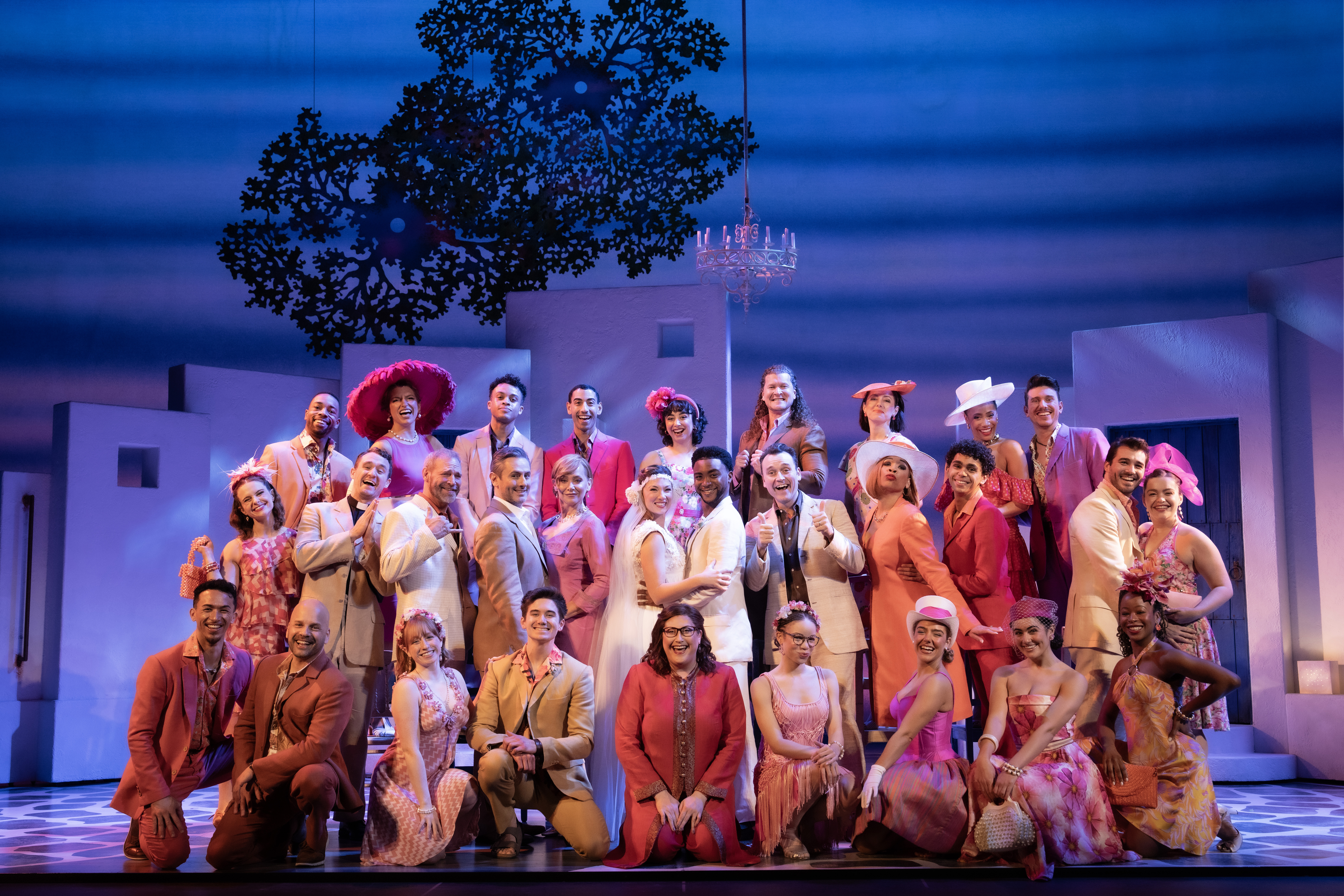 The Company of MAMMA MIA! standing together